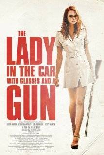 The Lady In The Car With Glasses And A Gun